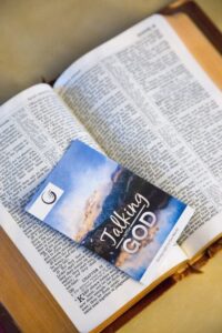 Open Bible with a pamphlet, Talking with God