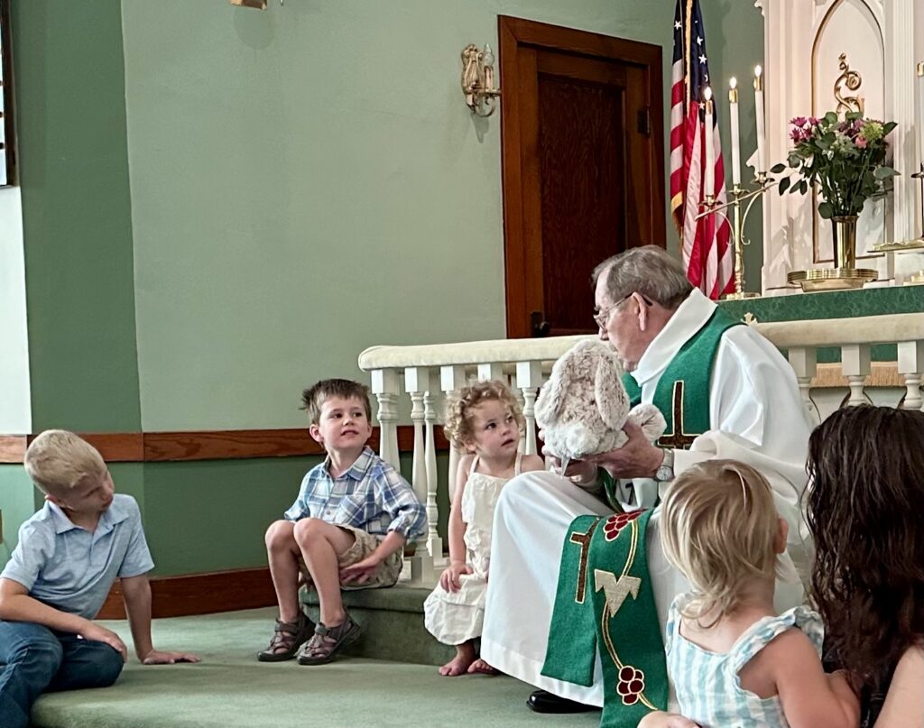 Pastor Dick Ewing shows Floppy Bunny to our children and tells a story. 